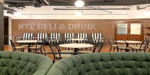 a dining room with tables and chairs and a brick wall at Crowne Plaza - Chicago West Loop, an IHG Hotel in Chicago