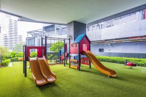 a playground in a building with a slide at Star Residences KLCC in Kuala Lumpur