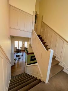 a staircase in a house with a stair case at Commercial Hotel Bega in Bega