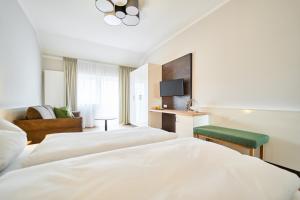 Katil atau katil-katil dalam bilik di Wirt z´Uttlau Familienhotel Höng