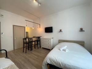 Postel nebo postele na pokoji v ubytování Appartements Foch