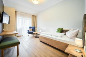 Televisyen dan/atau pusat hiburan di Wirt z´Uttlau Familienhotel Höng
