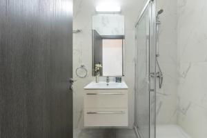 a white bathroom with a sink and a shower at Napa Bay View Villa 3 in Ayia Napa +51 photos
