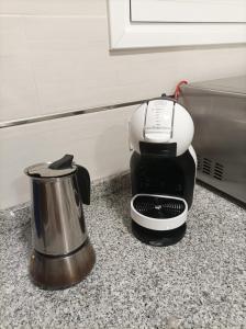 a coffee maker sitting on top of a counter at Bejar Alojamiento La Plaza in Béjar