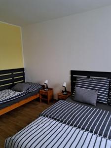 Postel nebo postele na pokoji v ubytování Penzion a Pizzerie Na Záložně