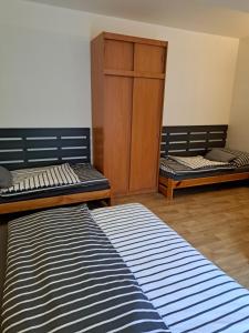Postel nebo postele na pokoji v ubytování Penzion a Pizzerie Na Záložně