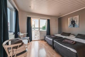 Postel nebo postele na pokoji v ubytování Nösund Havshotell