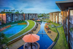 an overhead view of a pool at a resort at Extra large apartment with sea view & 2 pools in Bangrak Beach