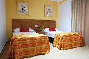 Säng eller sängar i ett rum på Apartamentos Turisticos Las Yucas