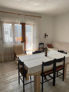 a living room with a table and chairs and a bed at Palada House with a Private Pool in Marina