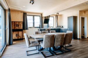 a dining room with a table and chairs at Clofers Active Apartments Sonnleitn in Hermagor