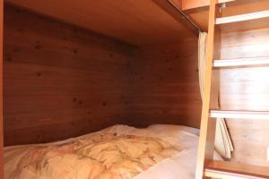 Postel nebo postele na pokoji v ubytování Tennenonsen Amuri