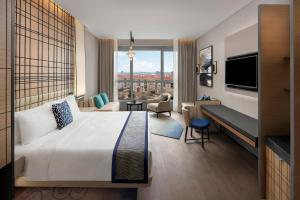 a hotel room with a bed and a large window at JW Marriott Hotel Istanbul Marmara Sea in Istanbul