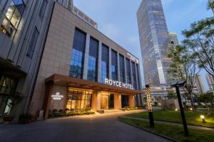 a building with a rogers hotel in a city at Royce Hotel Shenzhen in Shenzhen