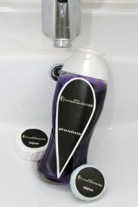 a purple and white hair dryer on a counter at Lux Apartmani Novi Park in Vrdnik