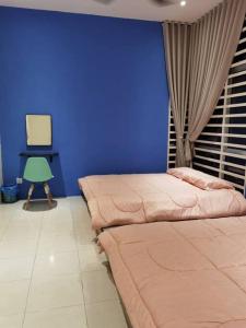 Un ou plusieurs lits dans un hébergement de l'établissement Ipoh Klebang CP Homestay
