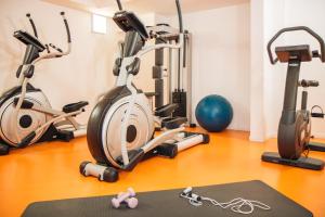 a gym with three exercise bikes and a ball at Twenty Business Flats Marseille Timone in Marseille
