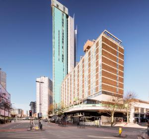 a tall building on a street in a city at Holiday Inn Birmingham City, an IHG Hotel in Birmingham