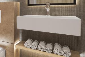 a bathroom with a sink and a row of rolled towels at Erzurumlu Hotel in Kilyos