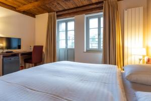 Un pat sau paturi într-o cameră la Le Rive Sud
