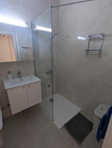 a bathroom with a shower and a sink at DreamIsland Maisonette Protaras in Paralimni