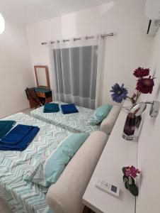 a bed with two pillows on it in a room at DreamIsland Maisonette Protaras in Paralimni