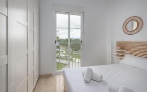 Postel nebo postele na pokoji v ubytování Small Oasis