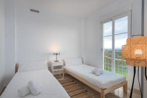 Postel nebo postele na pokoji v ubytování Small Oasis