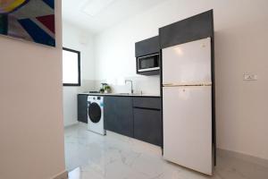 Kuchyň nebo kuchyňský kout v ubytování Al Kawther Hotel Apartments + 14 fotografií