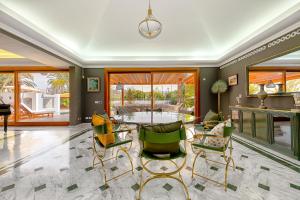 a living room with a table and chairs at Luxury Villa Maspalomas Golf in Maspalomas