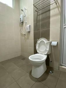 a bathroom with a toilet with the lid up at 110 Home Sleep Home Kuah Langkawi in Kuah