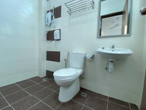 a bathroom with a toilet and a sink at 110 Home Sleep Home Kuah Langkawi in Kuah +17 photos