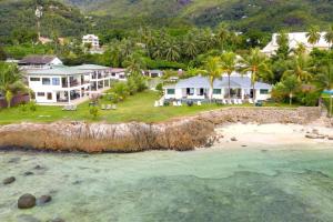 an aerial view of a house on a beach at Beach Cottages in Bel Ombre