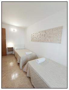 Posteľ alebo postele v izbe v ubytovaní APARTAMENTO CENTRICO JUNTO AL MAR - WIFI FREE