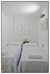 Posteľ alebo postele v izbe v ubytovaní APARTAMENTO CENTRICO JUNTO AL MAR - WIFI FREE