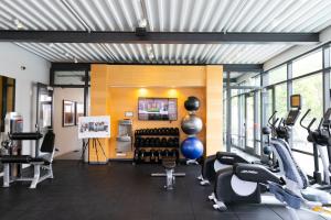 a gym with treadmills and exercise equipment in a building at Evanston 1BR w Pool Gym nr Nwestern CHI-702 in Evanston