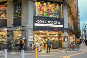 a zon food store with people walking in front of it at LEOPARD Shinsaibashi in Osaka