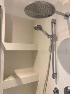 a shower with a shower head in a bathroom at San Giuseppe Casa per Ferie in Quercianella +37 photos