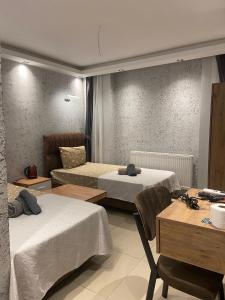 Postel nebo postele na pokoji v ubytování Grand Macit Otel