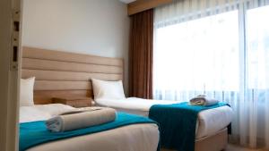 Bursa Suites Apart Otel客房内的一张或多张床位