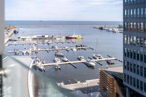 a view of a marina with boats in the water at Glob Apartament Sea Towers Gdynia in Gdynia