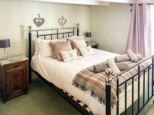 Ένα ή περισσότερα κρεβάτια σε δωμάτιο στο Billy Napps Cottage