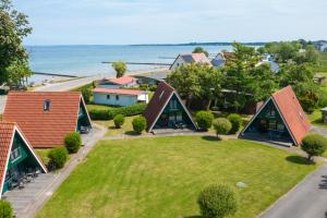 an aerial view of a house with a lawn at An der Steilküste Finnhütte 03 in Boltenhagen