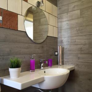 a bathroom with a white sink and a mirror at Terra di Sicilia in Avola