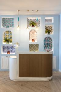 a room with stained glass windows on the wall at Delta Hotels by Marriott Giardini Naxos in Giardini Naxos