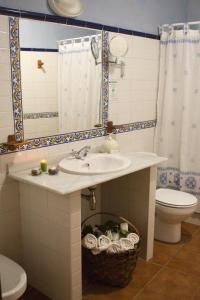 a bathroom with a sink and a toilet at Casa Rural Las Martas in Acebo +42 photos