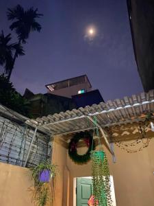 a porch with a christmas wreath and a door at T30 Hanoi Homestay, near Lotte Tay Ho, 25minutes to the airport in Hanoi