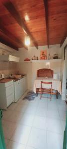 a kitchen with a bed and a table in a room at Marina Studios in Symi