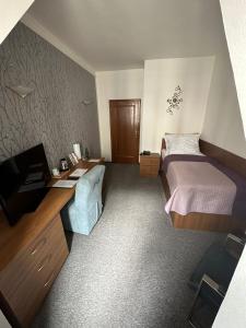 Postel nebo postele na pokoji v ubytování Hotel Radnice