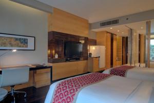 Postel nebo postele na pokoji v ubytování JW Marriott Hotel New Delhi Aerocity